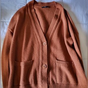 large orange cardigan